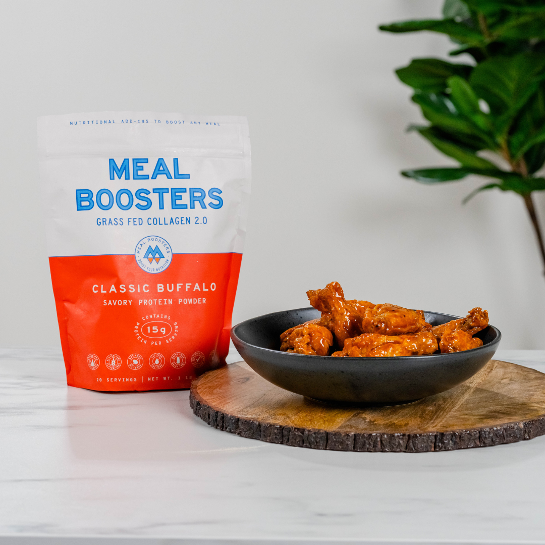 Meal Boosters Buffalo collagen+ protein powder bag beside buffalo wings on wooden board on Tampa Home & Garden Store