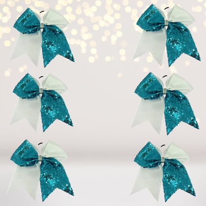 Sequin Cheer Bow 6-Pack, 6.5-inch teal sequin bows with white satin tails on alligator clips on Tampa Home & Garden Store