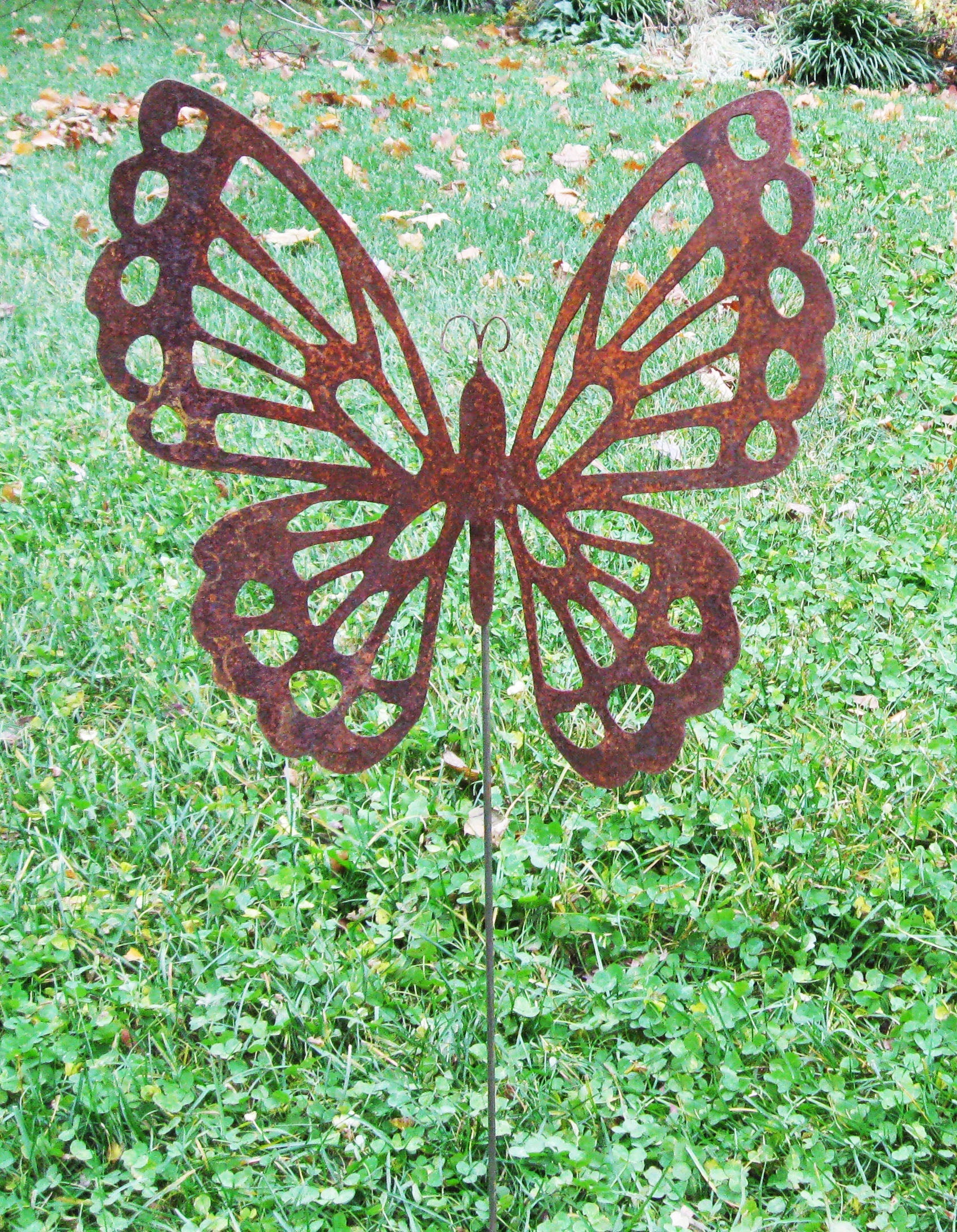 Butterfly Garden Stake rusted metal with petal-like cutouts, Rustica Ornamentals garden sculpture on Tampa Home & Garden Store