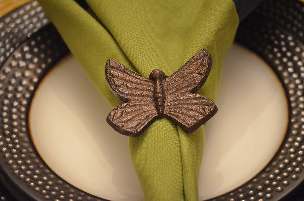 Vibhsa handcrafted antique butterfly napkin ring aluminum with napkin on beaded plate on Tampa Home & Garden Store