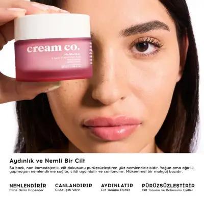 Cream Co. Brightening Care Set face serum in pink jar held near model on Tampa Home & Garden Store