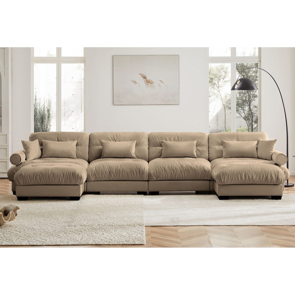 Modern sectional sofa with ottoman beige fabric, round bolster arms and pillows in a living room on Tampa Home & Garden Store