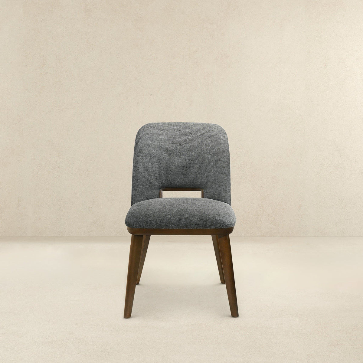 Modern dining chair with gray fabric upholstery and walnut wood legs on Tampa Home & Garden Store