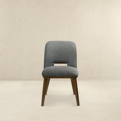 Modern dining chair with gray fabric upholstery and walnut wood legs on Tampa Home & Garden Store