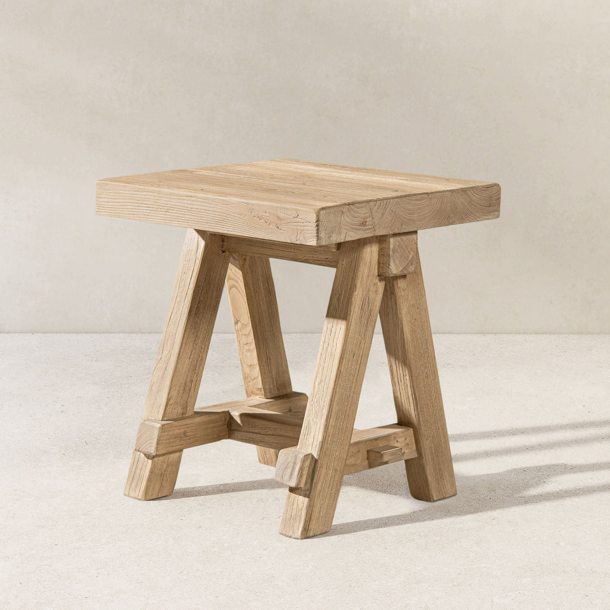 Trestle coffee table with solid reclaimed elm construction in light brown finish on Tampa Home & Garden Store