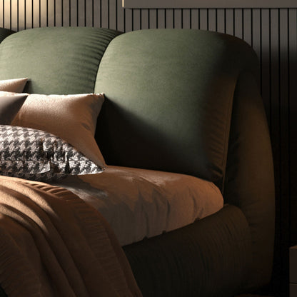 Olive-green velvet upholstered platform bed with oversized padded backrest and dark wood frame on Tampa Home & Garden Store