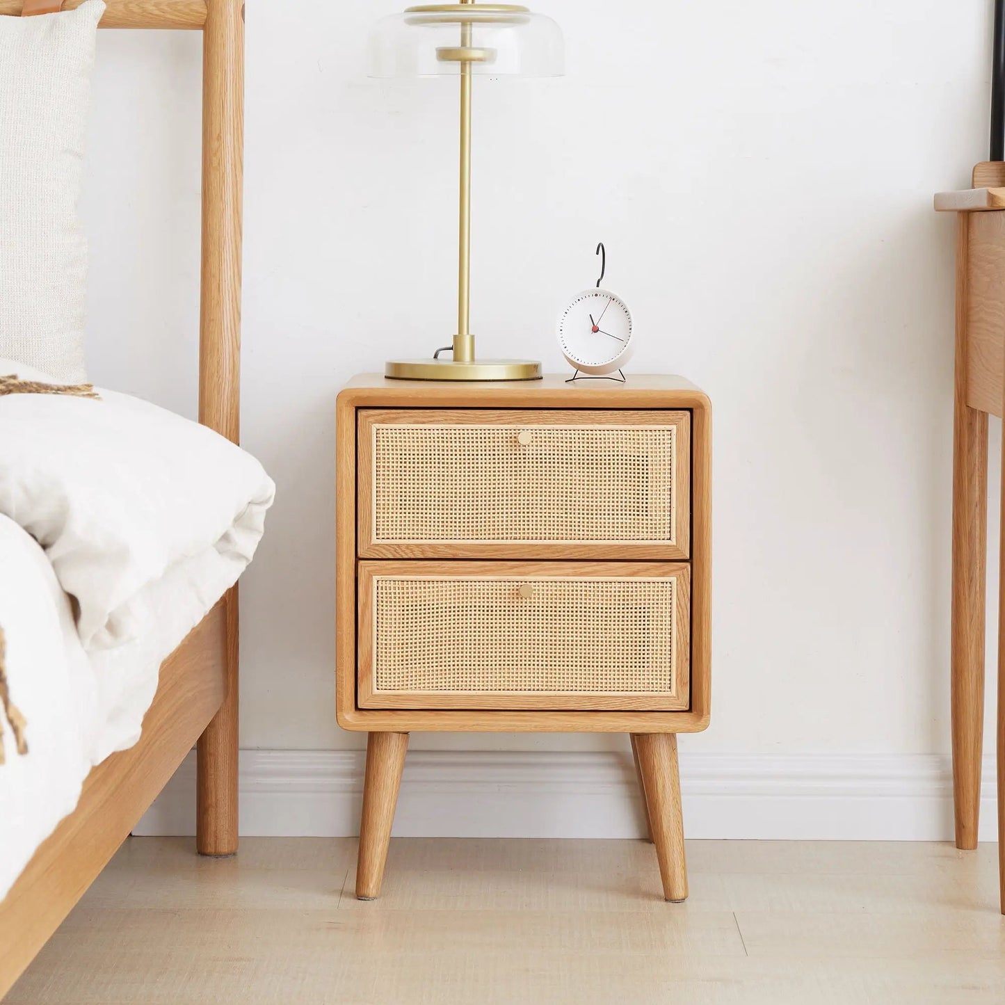 Bedside nightstand in European beech with woven cane drawer fronts and angled legs on Tampa Home & Garden Store