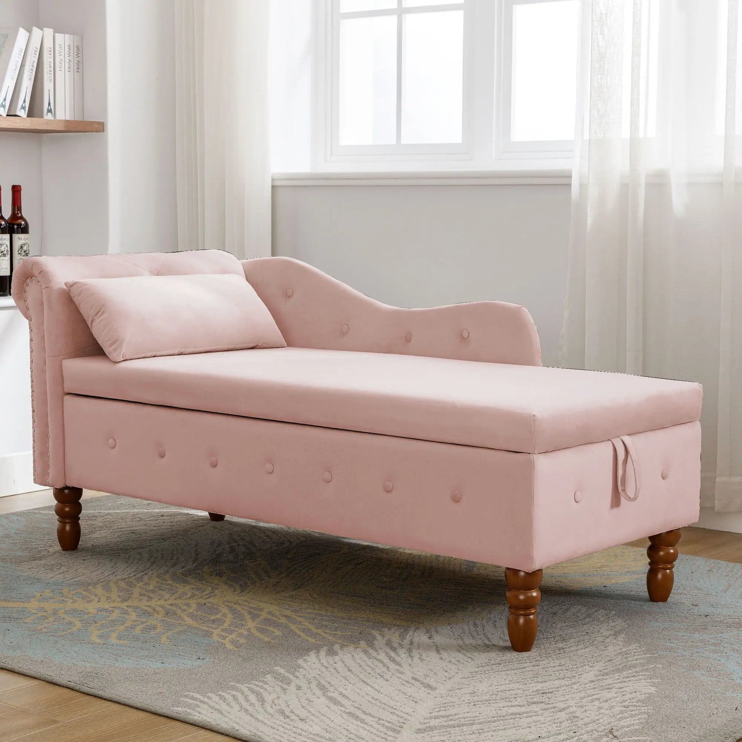 Pink upholstered chaise lounge with nailhead trim rolled arms and storage pillow in bedroom on Tampa Home & Garden Store