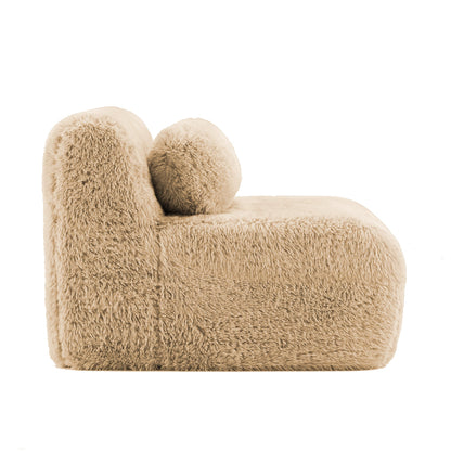 Aviana armless sofa with two fluffy pillows in plush light khaki fabric on Tampa Home & Garden Store