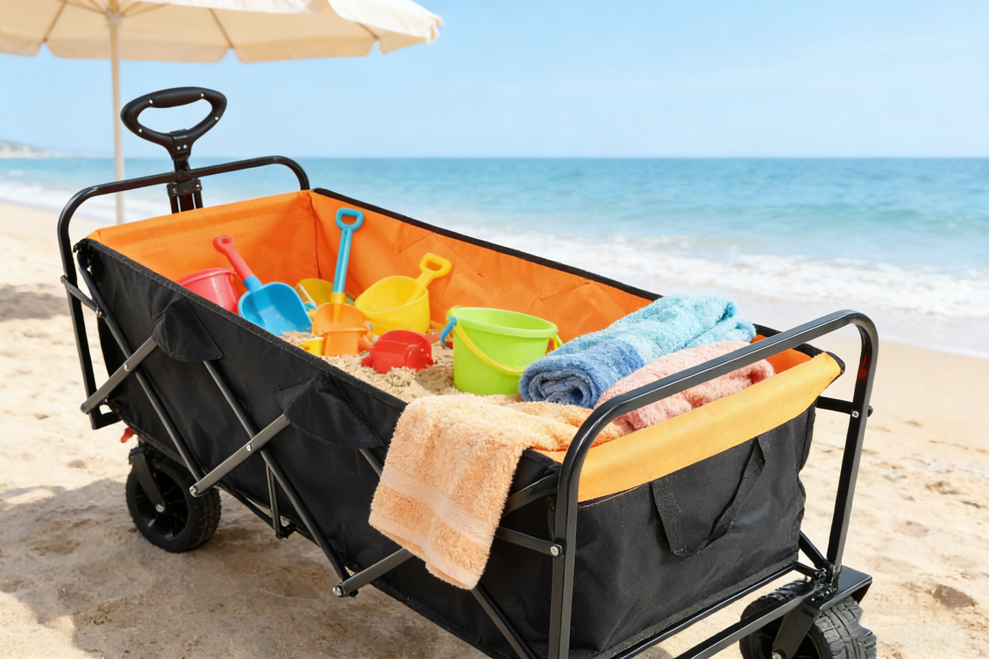 Big folding wagon cart with extender, black exterior orange interior, beach toys on Tampa Home & Garden Store
