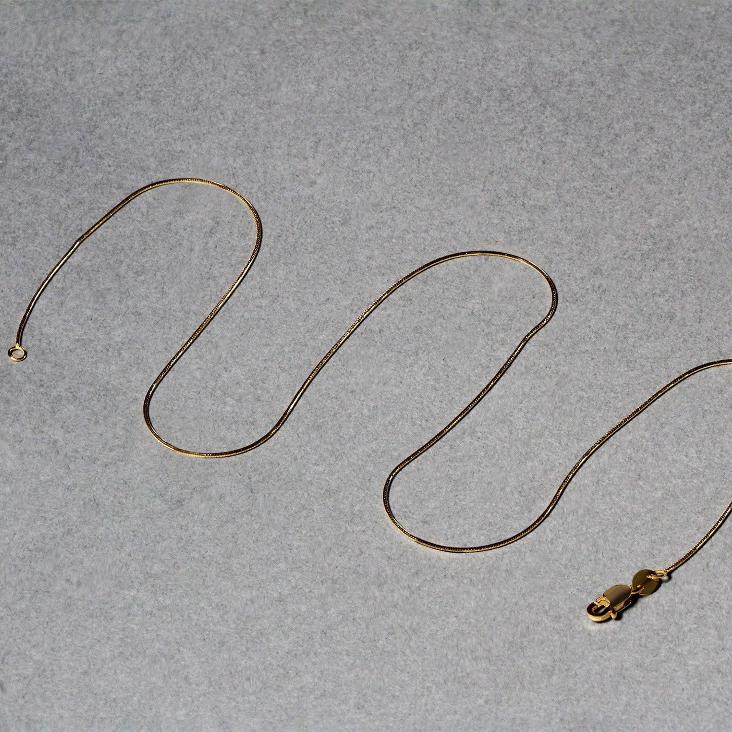 14k yellow gold round snake chain necklace 0.7mm with lobster clasp by Bids.com on Tampa Home & Garden Store