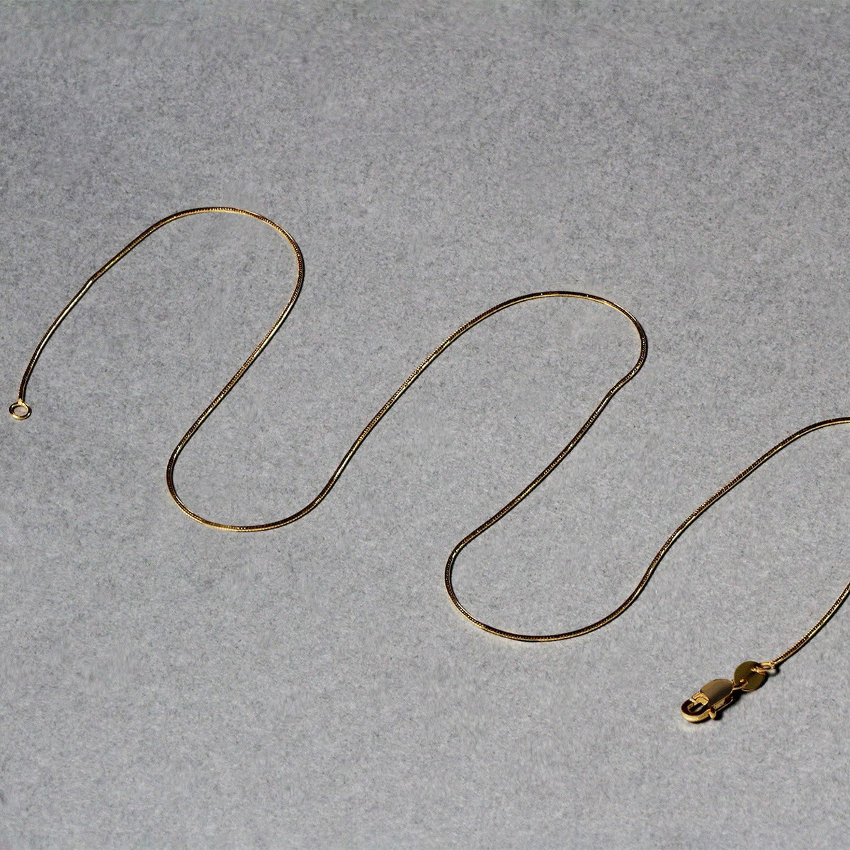 14k yellow gold round snake chain necklace 0.7mm with lobster clasp by Bids.com on Tampa Home & Garden Store