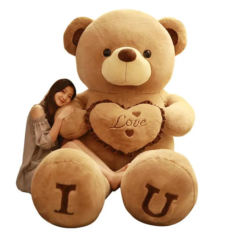 Chinese Valentine's Day Hug Bear plush toy, tan teddy holding a ruffled heart with Love on Tampa Home & Garden Store