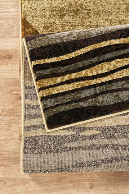 Bristol Modern Geometric Area Rug In Multi, striped brown tan gold palette on wood floor on Tampa Home & Garden Store