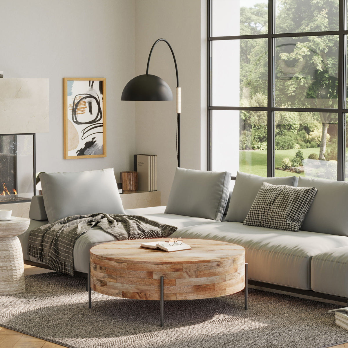 Solid round mango wood coffee table by HouseOfZazla with black metal legs on Tampa Home & Garden Store