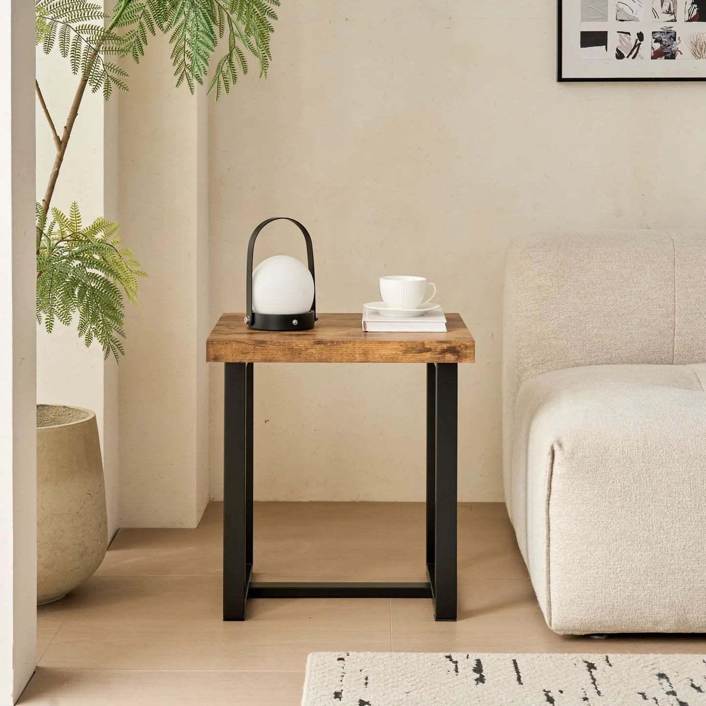 Coffee table in warm wood with black metal legs by Unique Piece Furniture in a living room setup on Tampa Home & Garden Store