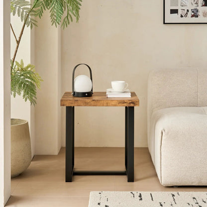 Coffee table in warm wood with black metal legs by Unique Piece Furniture in a living room setup on Tampa Home & Garden Store