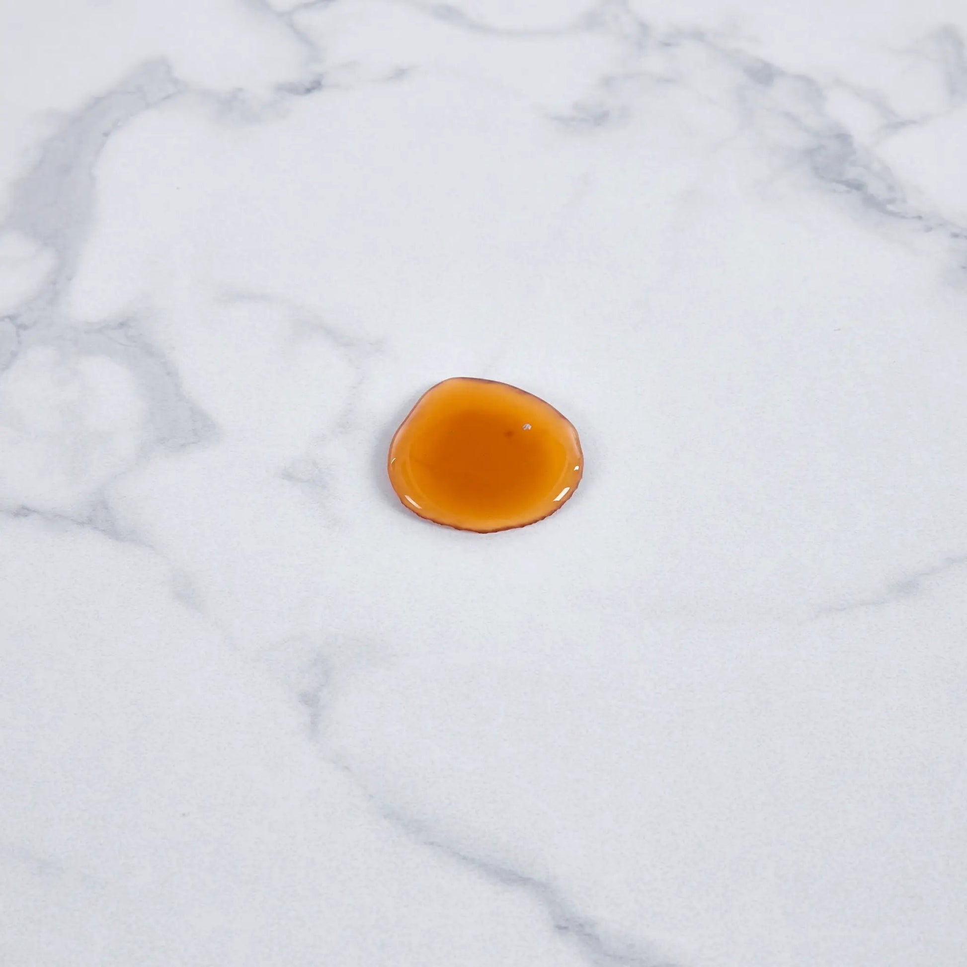 Tulip Special Dining Table orange accent on white marble surface Unique Piece Furniture on Tampa Home & Garden Store