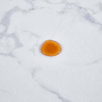 Tulip Special Dining Table orange accent on white marble surface Unique Piece Furniture on Tampa Home & Garden Store