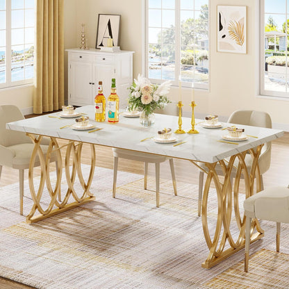 Large rectangular dining table with white marble top and gold geometric legs on Tampa Home & Garden Store