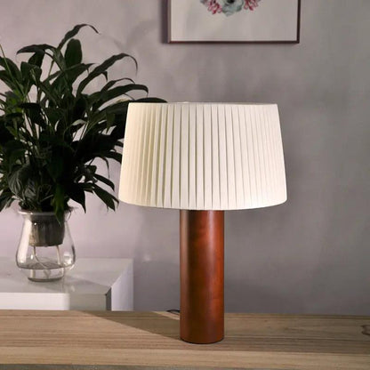 Korean-style pleated table lamp with solid wood cylindrical base and white shade on desk on Tampa Home & Garden Store