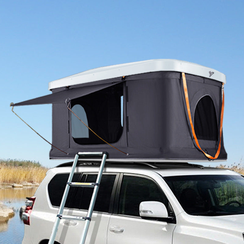 Rooftop camping tent Sell My Stuff, dark gray fabric, white hard shell mounted on SUV on Tampa Home & Garden Store