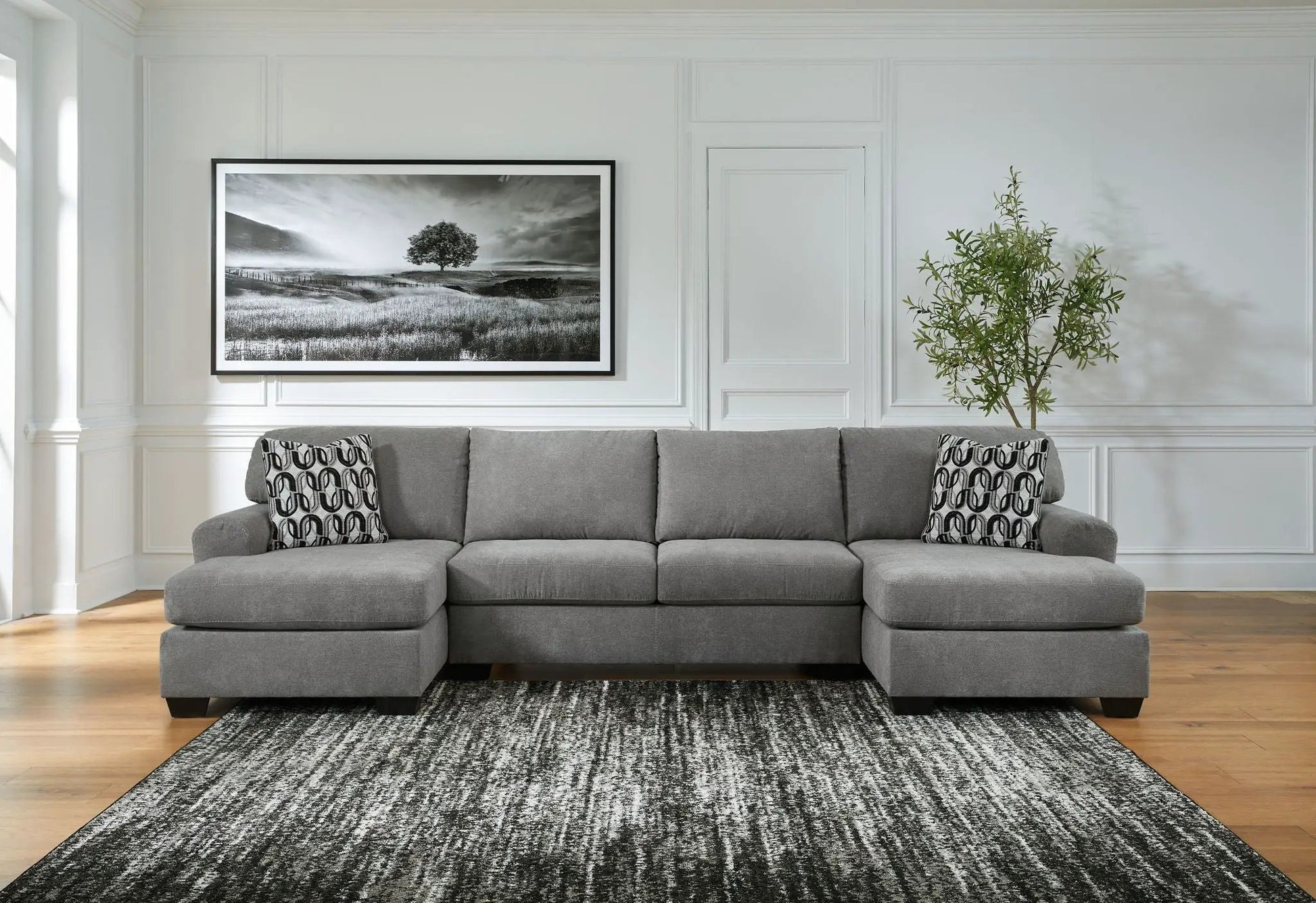 Birkdale Court stationary sectional gray fabric by Unique Piece Furniture in white paneled walls on Tampa Home & Garden Store