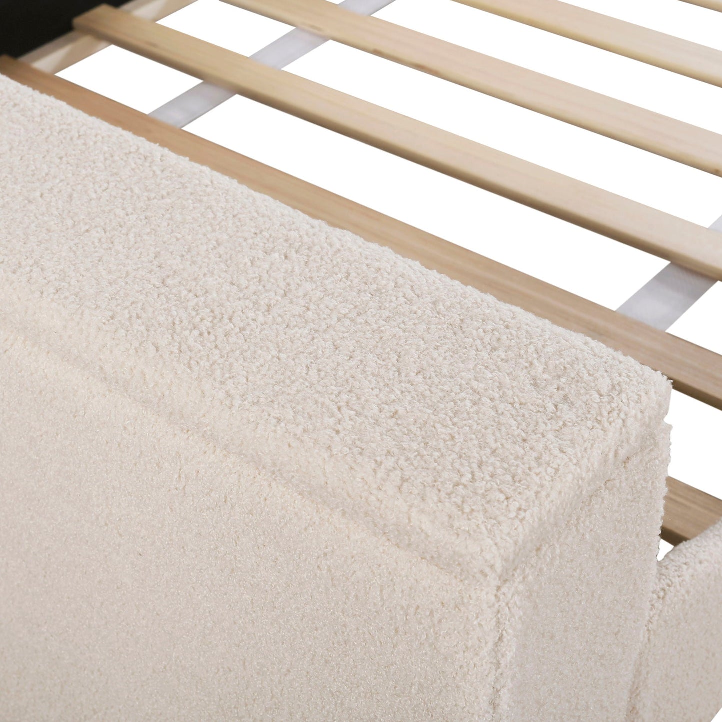 Wood slat bed frame with light finish and beige shag rug on Tampa Home & Garden Store