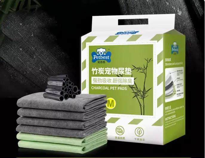 Petbest charcoal dog training pads in a green box with stacked gray and green absorbent pads on Tampa Home & Garden Store