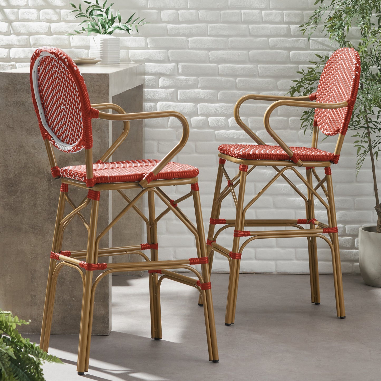 Outdoor wicker and aluminum French barstools, set of 2 with red woven seats and tan frames on Tampa Home & Garden Store