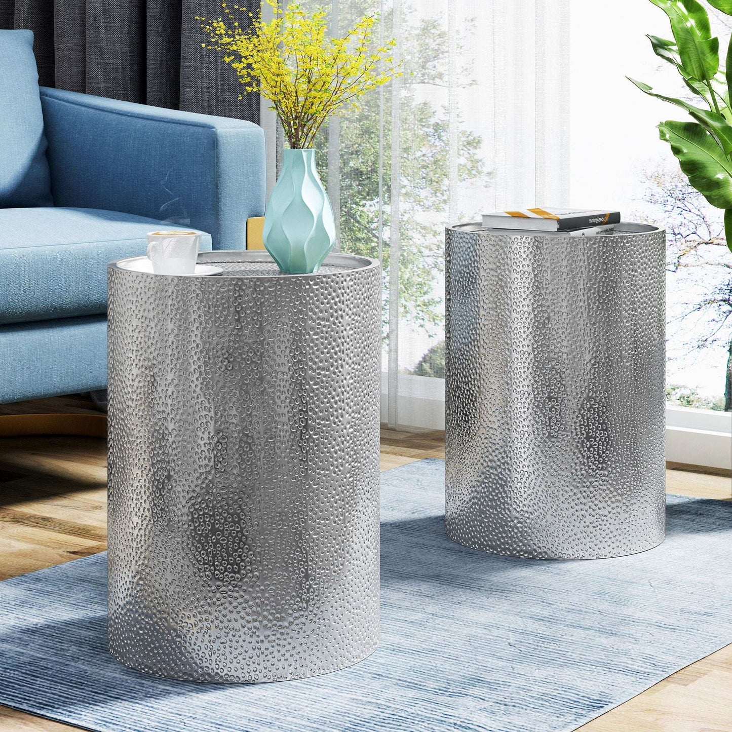 Modern round accent table with hammered silver metal finish on Tampa Home & Garden Store
