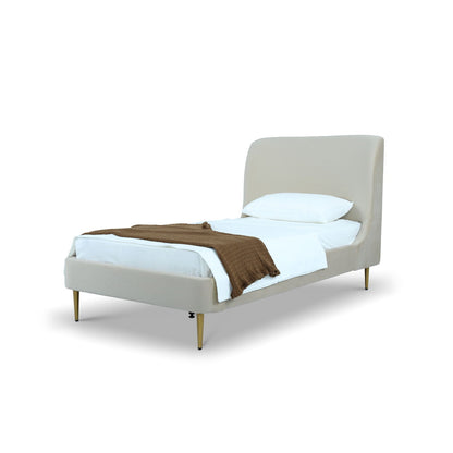 Mid-Century Modern upholstered bed with curved beige headboard and gold tapered legs on Tampa Home & Garden Store