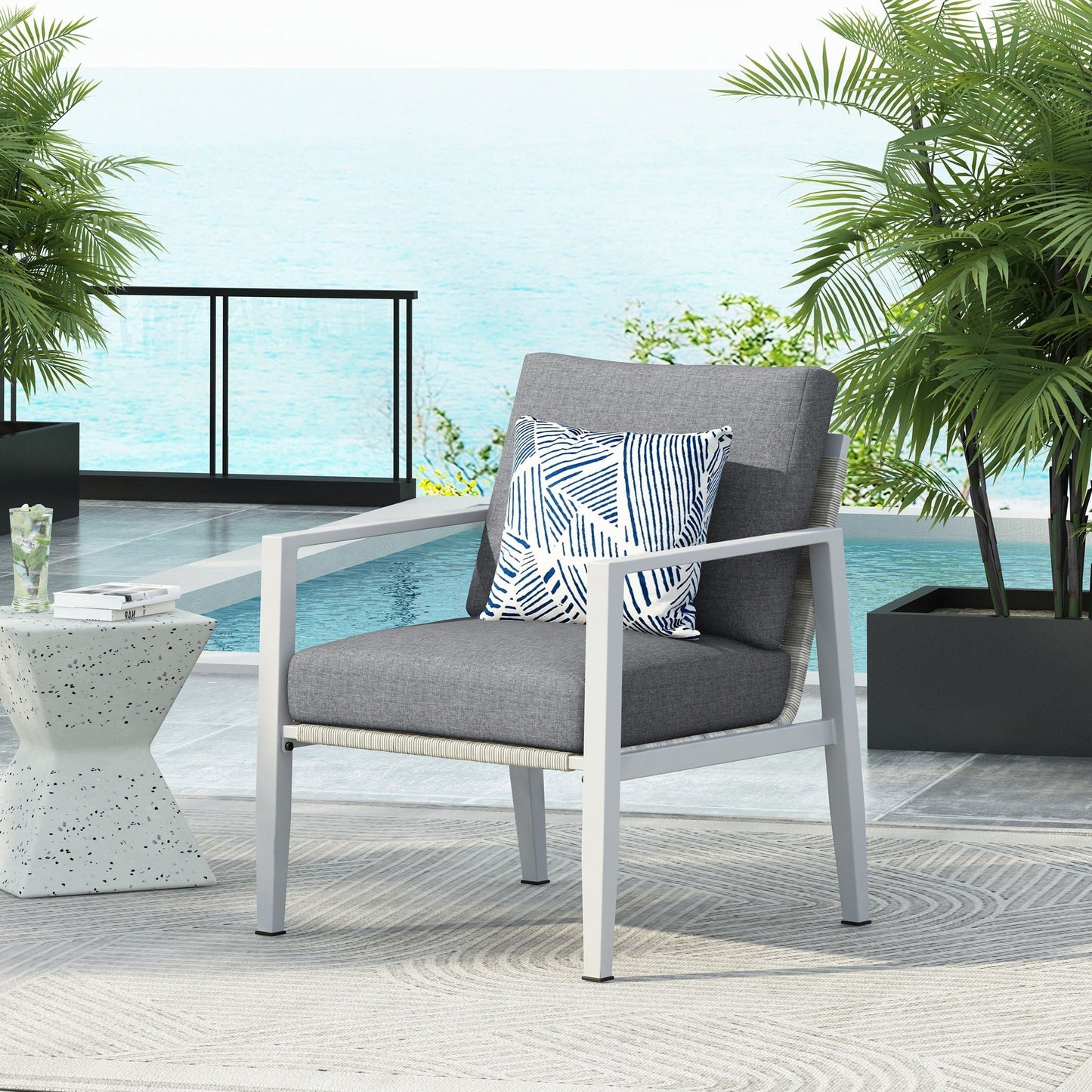 Modern rope-accented outdoor club chair by HouseOfZazla with grey cushions on Tampa Home & Garden Store