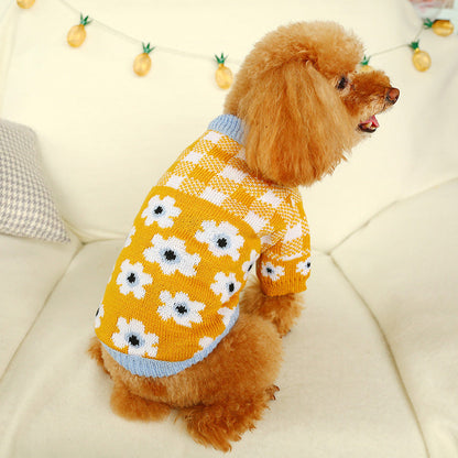 Bowknot dog sweater by Pet Zen in yellow knit with white flowers and blue trim on a poodle on Tampa Home & Garden Store