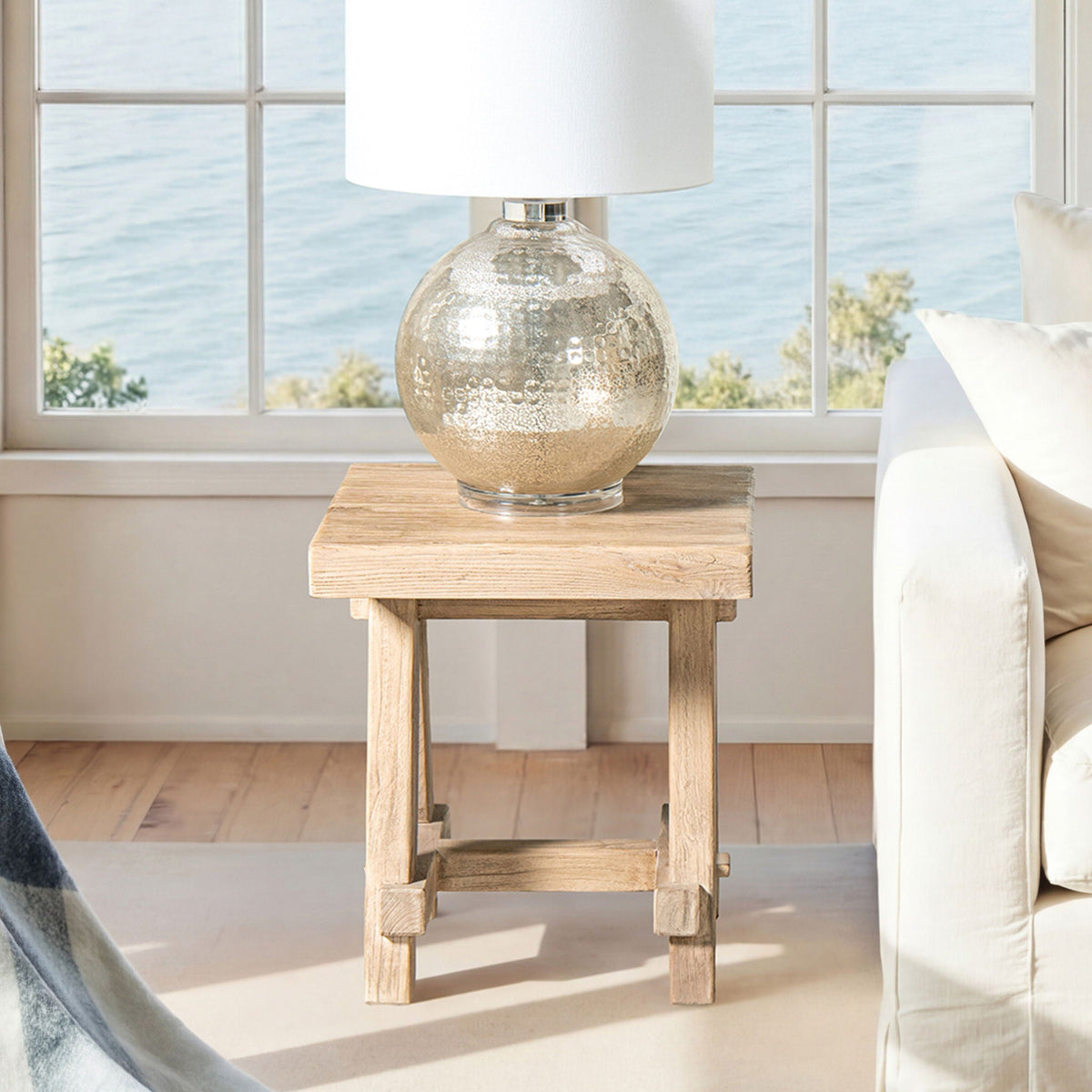 Trestle coffee table in solid reclaimed elm with a light brown finish and visible wood grain on Tampa Home & Garden Store