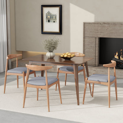 Elegant light wood dining chairs with ergonomic backrests and cushioned blue-gray seats on Tampa Home & Garden Store