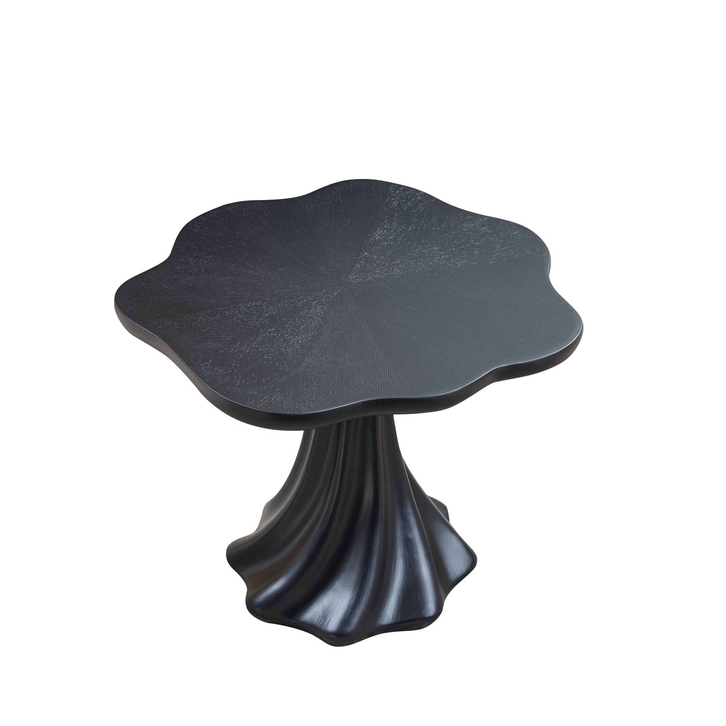 Sculptural round dining table with petal-shaped black top and root texture on pedestal base on Tampa Home & Garden Store