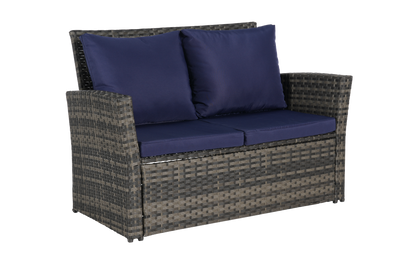 4-piece outdoor patio furniture set with rattan seating and navy cushions on Tampa Home & Garden Store