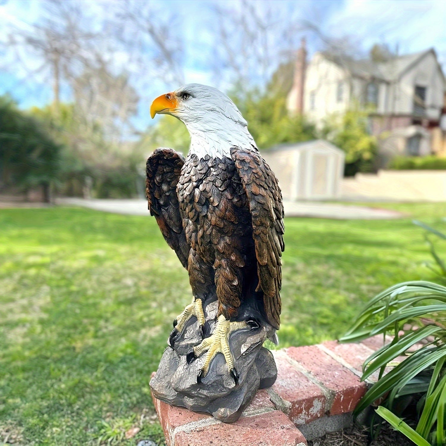 Large Bald Eagle Garden Statue by HouseOfZazla, gray head, brown feathers perched on rock on Tampa Home & Garden Store