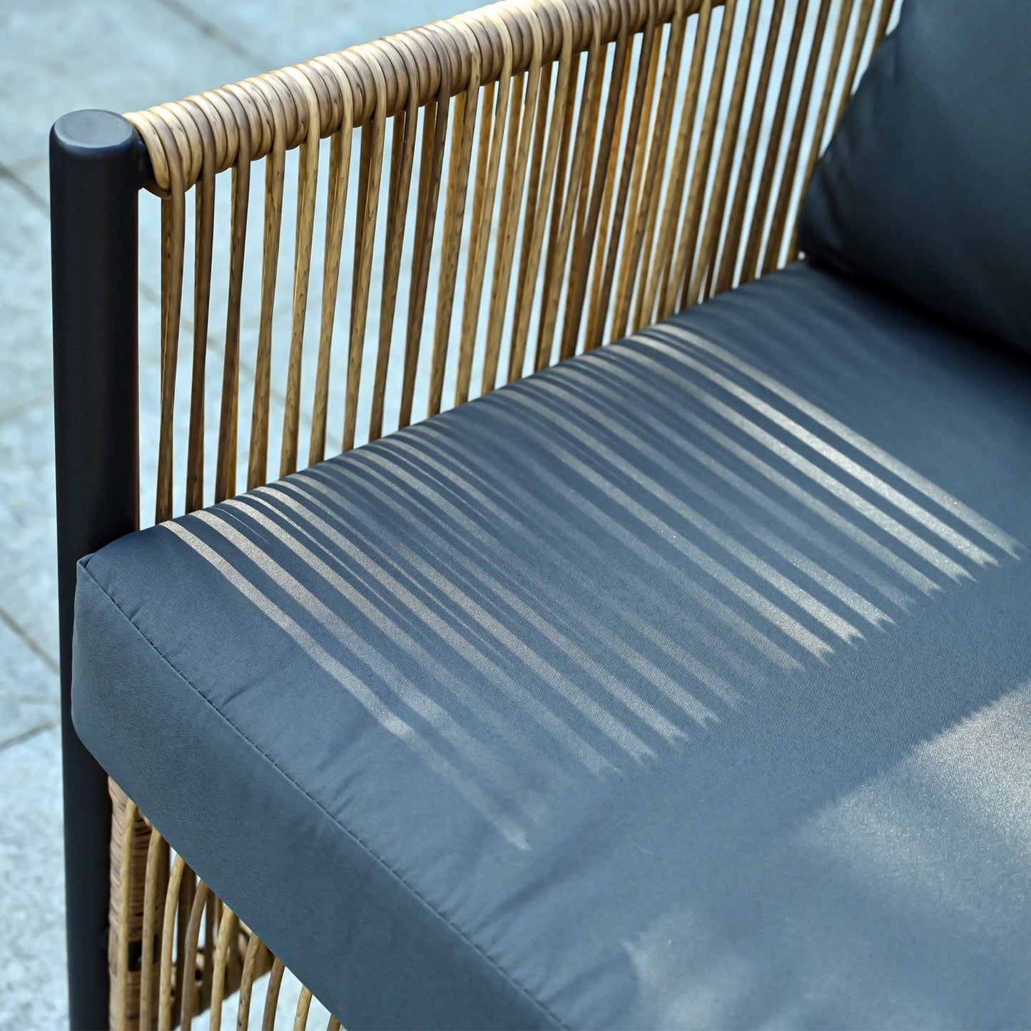 Outdoor PE wicker 2-seater sofa with grey cushions and dark metal frame on Tampa Home & Garden Store
