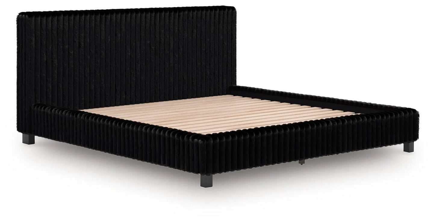 Zuraleus Upholstered Bed in black velvet with vertical channel tufting and low-profile frame on Tampa Home & Garden Store