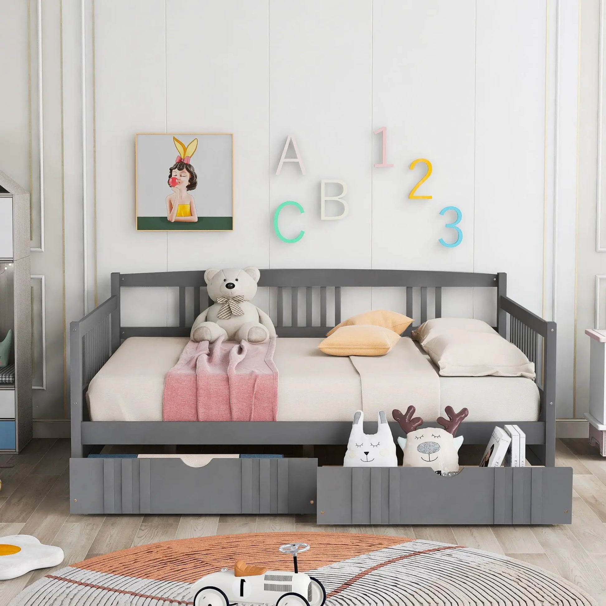 Multifunctional gray daybed with 3 under-bed drawers; pastel decor and plush bear in a nursery on Tampa Home & Garden Store