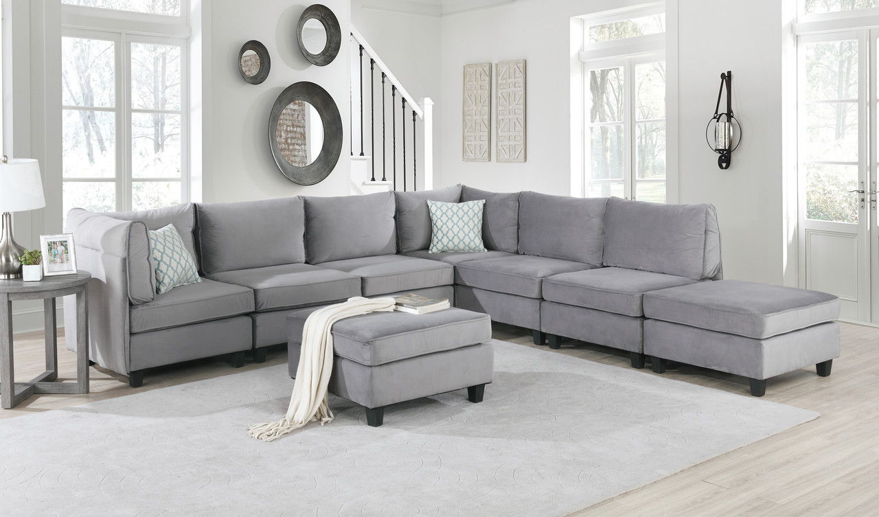 Simona modular sectional sofa in gray fabric with chaise and matching ottoman on Tampa Home & Garden Store