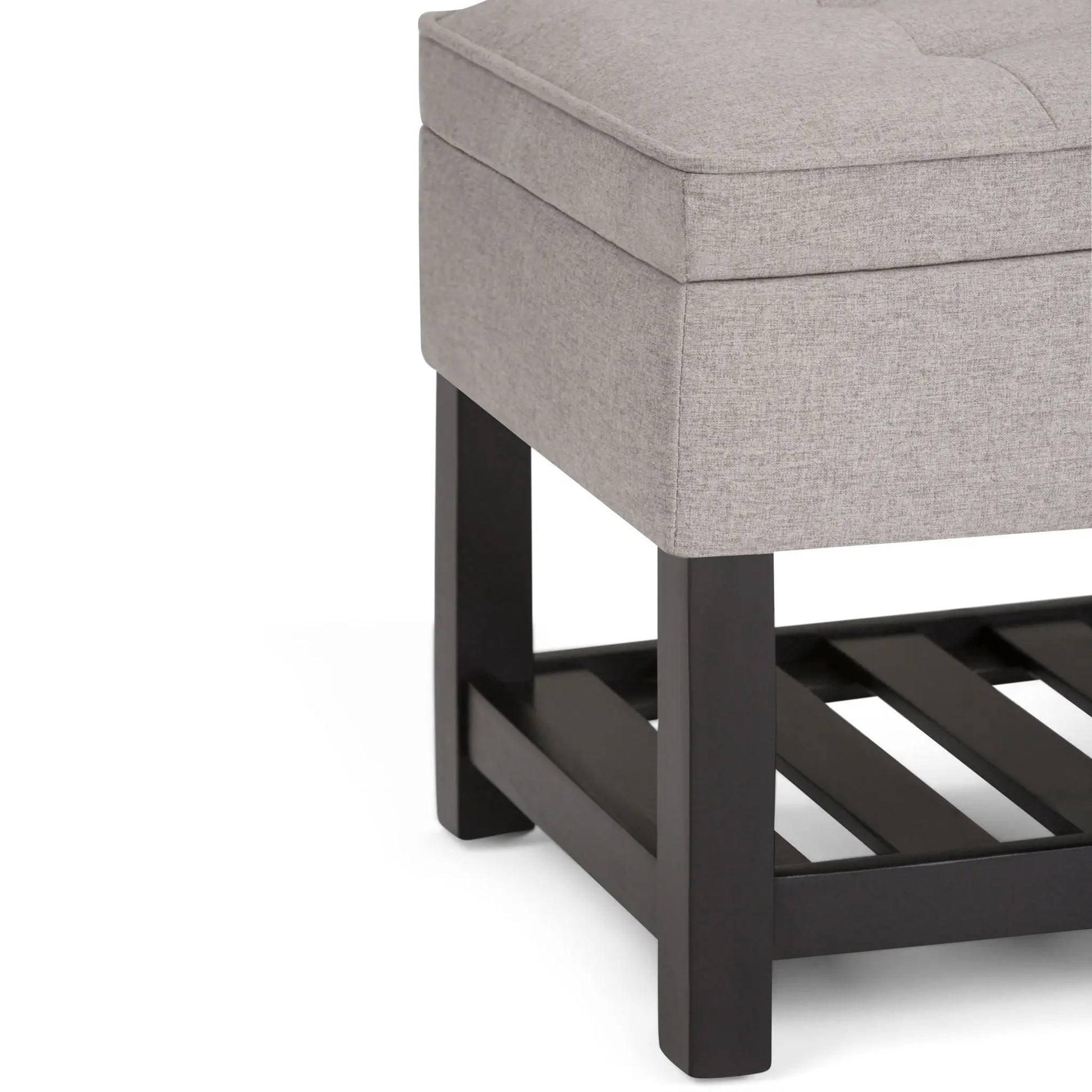 Cosmopolitan storage ottoman bench with open bottom, grey fabric, black legs on Tampa Home & Garden Store