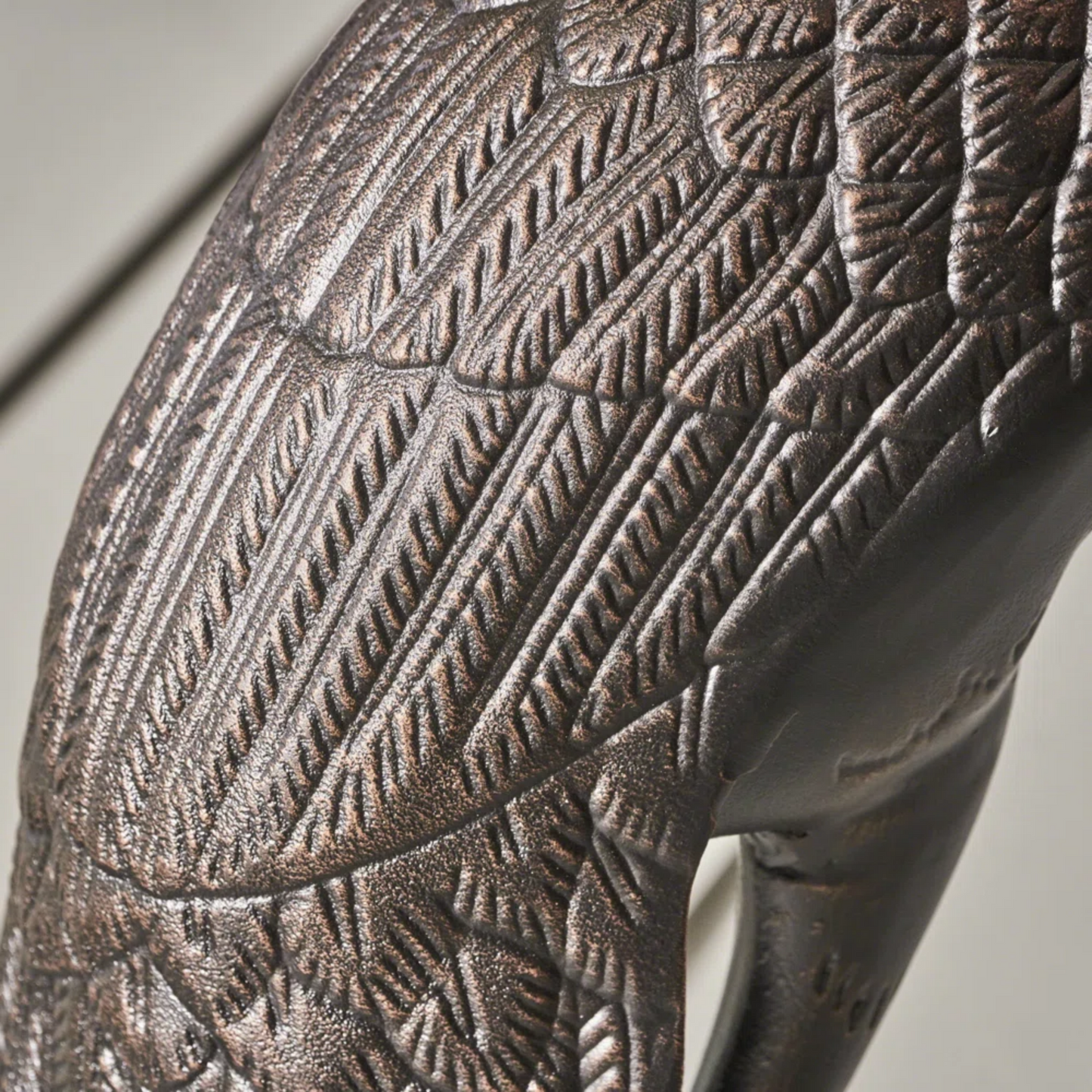 Cranes outdoor decor accessory close-up showing bronze textured feather pattern on Tampa Home & Garden Store