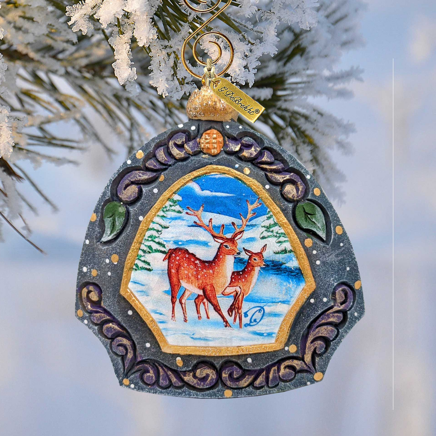 Hand Painted Deer Family Ornament by G. DeBrekht, sculpted frame with winter scene of two deer on Tampa Home & Garden Store