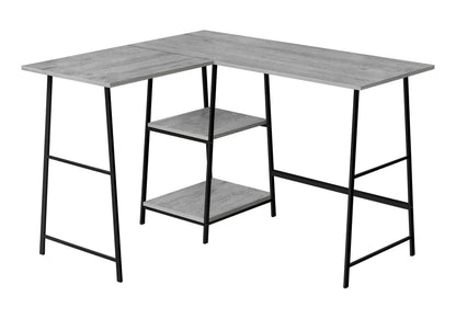 L-shaped computer desk with grey wood grain top, black metal frame, and integrated lower storage shelves on Tampa Home & Garden Store