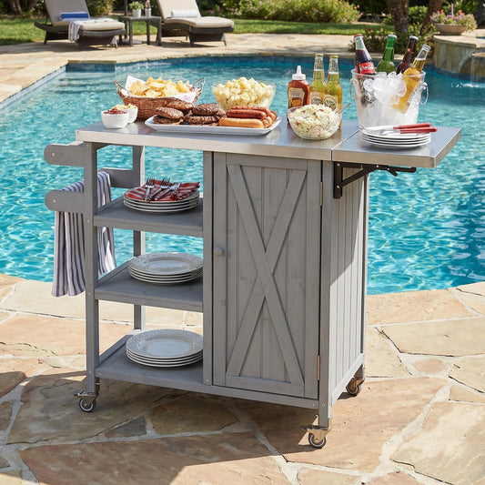Foldable outdoor kitchen island cart by pool from HouseOfZazla with plates, bowls and beverages on Tampa Home & Garden Store