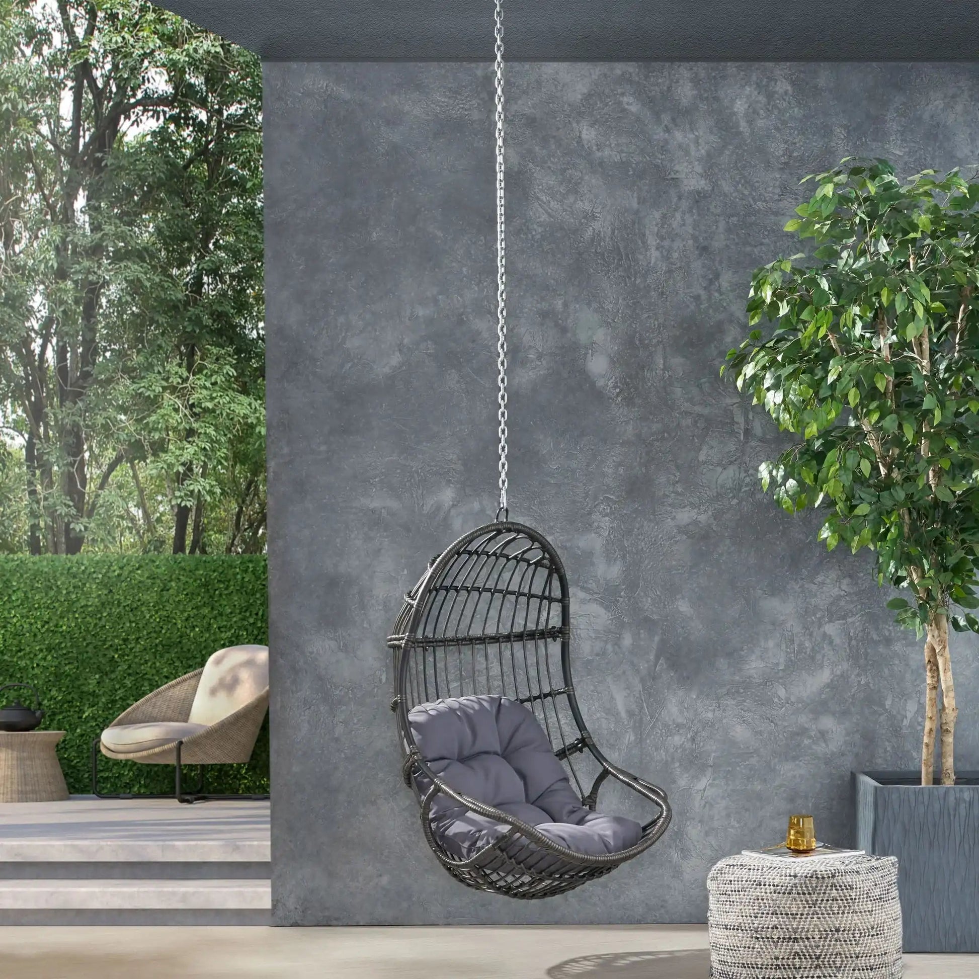 Rustic Hanging Basket Chair With Cushion by HouseOfZazla black woven frame with gray cushion on Tampa Home & Garden Store