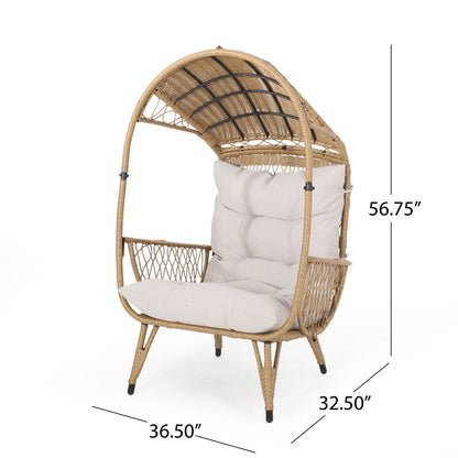 Outdoor wicker standing basket chair with beige cushion, curved back and natural frame on Tampa Home & Garden Store